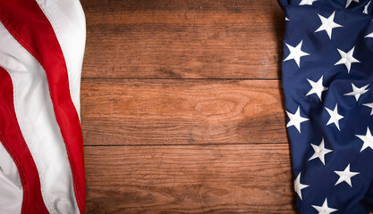 Flat lay USA flag on brown wooden board, vintage background with copy space top view. Banner,...