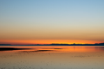 Sunset on the calm sea with really incredible white reflections.