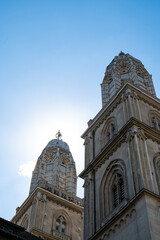 Fototapeta na wymiar The twin towers of Grossmunster church in Zurich city Switzerland. Sunny summer day, no people