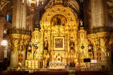Golden altar -detail of the Interior of Metropolitan Cathedral of Assumption of Mary (Catedral Metropolitana de la Asuncion de Maria)- largest and oldest cathedral in the Americas Mexico City, Mexico.