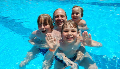 family in pool