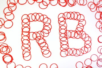 Red rubber band with initials 