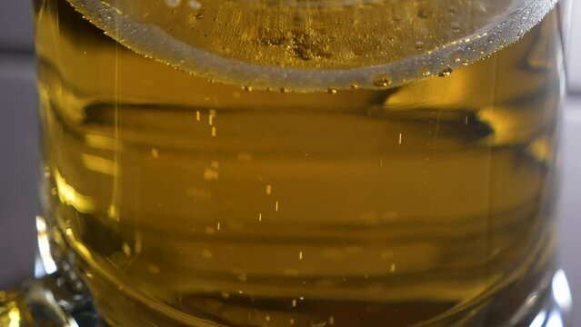 Close up view of beer in a glass, top view.