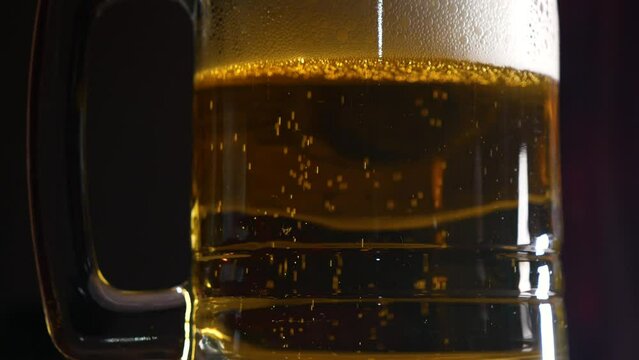 Panning up slowly looking at beer in a glass