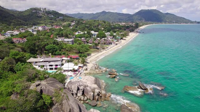 Beautiful 4K drone footage of the beach and unique rock features at Hin Ta Hin Yai Beach on Koh Samui in Thailand