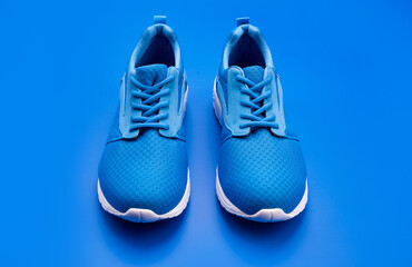 pair of comfortable blue sport shoes on blue background, shoes