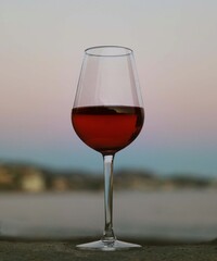glass of red wine at sunset