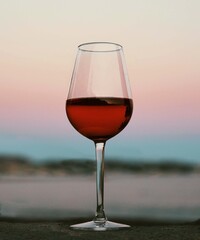 glass of red wine at sunset
