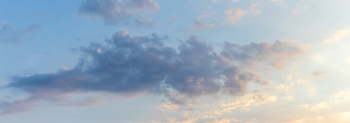 Dark cloud in blue sky during sunset