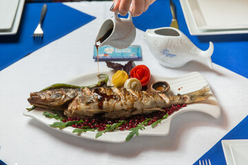 Fried fish Pike perch with decoration studio shooting