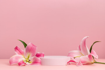 Podium with pink lily, round cylinder scene with flowers on pink background, display for cosmetics,...