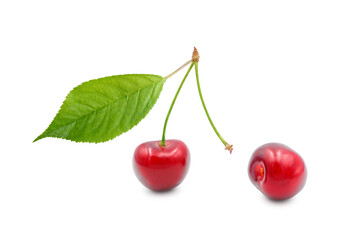 Ripe cherries with leaf, one berry is torn off. Isolated on white background. Parting, separation, breakup concept.
