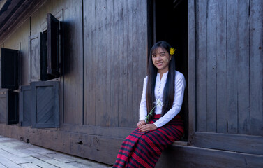 Beautiful happiness smile woman in Mandalay, Myanmar wearing traditional dressing have apply powder...