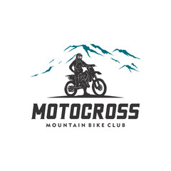 Motocross silhouette in the mountain logo design template