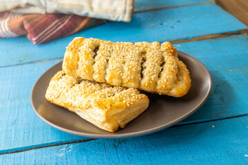 puff pastry poppy seads tarts on a wooden surface. food concept