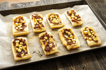 puff pastry apple tarts on a wooden surface. food concept