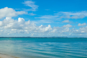 Fototapeta na wymiar Turquoise sea background with blue sky fluffy cloud nature landscape