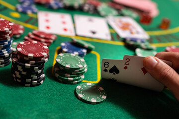 man playing blackjack at the table and betting chips