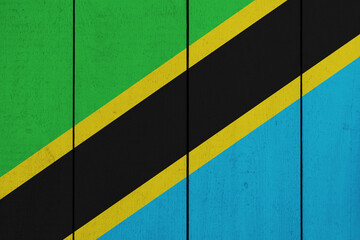 Patriotic wooden plank background in colors of flag. Tanzania