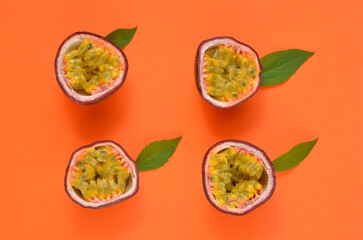 bright background, halves of passion fruit on an orange background