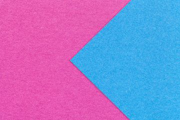 Fototapeta na wymiar Texture of purple and blue paper background, half two colors with arrow, macro. Structure of craft magenta cardboard