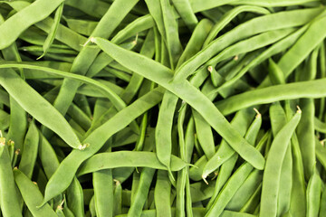 green romano beans on the counter in the market