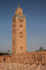 Fototapeta premium Koutoubia Mosque is the largest mosque in Marrakesh, Morocco, Africa. Located in the Jewish quarter, in the old Medina. The minaret tower is ornamented with curved windows, a band of ceramic inlay.