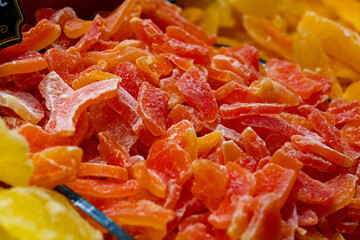 Pieces of dry candied fruits for background