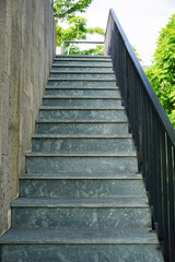Outdoor stone stairs and steel banister of a villa                              
