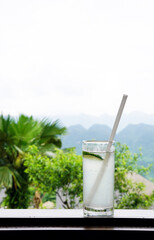 Refreshing lime juice glass in the background of Pu Luong mountain, Vietnam
