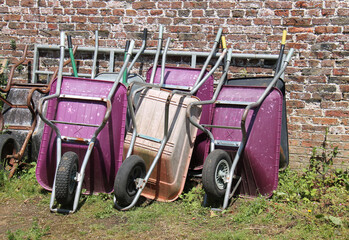 A Collection of Well Used Gardening Wheelbarrows.