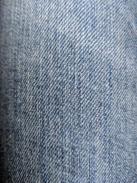 Fondo de textura de ropa vaquera con el t&iacute;pico color azul denim