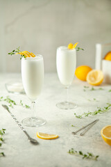 Two glasses of lemon sorbet on the table - obrazy, fototapety, plakaty