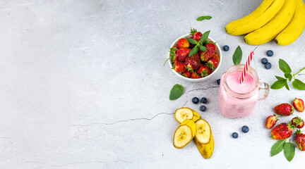 fruit cocktail with fresh strawberries, banana and blueberries. banner with place for text. © Светлана Парникова