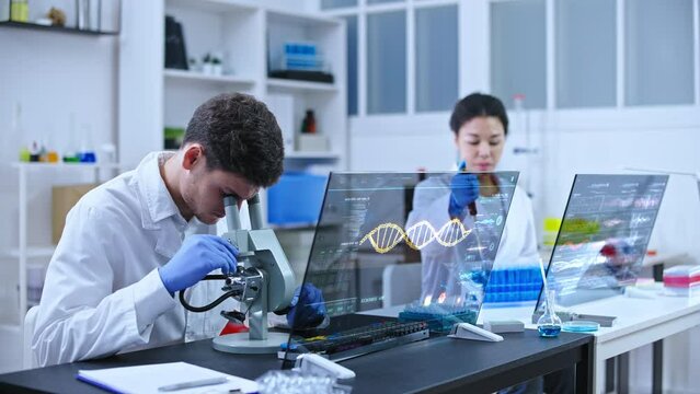 Genetic scientists working on DNA test in modern laboratory, biotechnology