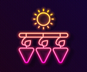 Glowing neon line Drying grapes icon isolated on black background. Dried grapes. Vector