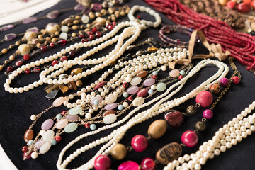 Antiques at flea market or garage sale - vintage jewelry, retro pearl necklace and other vintage...
