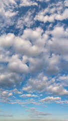 Fantastic clouds against blue sky, panorama