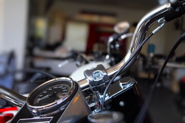 Chrome motorbike handlebar at motorcycle customizing workshop
