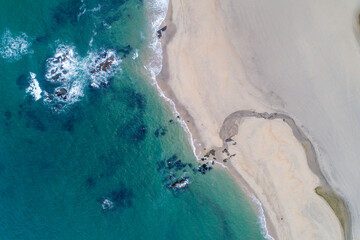 Fototapeta na wymiar Aerial view of a beach with a small river