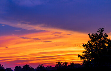 Dramatic colorful monsoon cloud formation in the sky during sunset