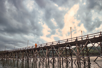 Wooden bridge in Sangkhlaburi district Thailand is a community of indigenous Mon people with old culture. It is natural and a tourist destination.