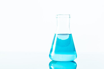blue science experiment flask on white background