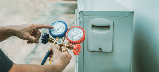 Heating and air conditioning HVAC service technicians use common gauges. Check refrigerant and add...