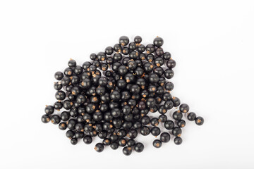 Isolated berries. Five falling black currant fruits isolated on white background with clipping path