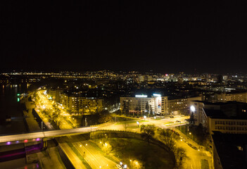The capital of Vojvodina, Novi sad at night. The bridge on the Danube river. Aerial photography.