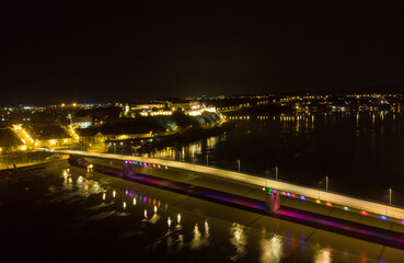 The capital of Vojvodina, Novi sad at night. The bridge on the Danube river. Aerial photography.
