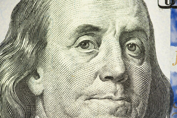 Close up of new hundred dollar bill. Macro close up of Ben Franklin. 100 dollar bill. financial concept.
