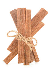 Sandalwood sticks tied with rope isolated on a white background