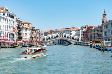 Rialto bridge in Venice with a boat
